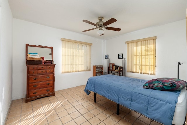 bedroom with light tile patterned floors and ceiling fan