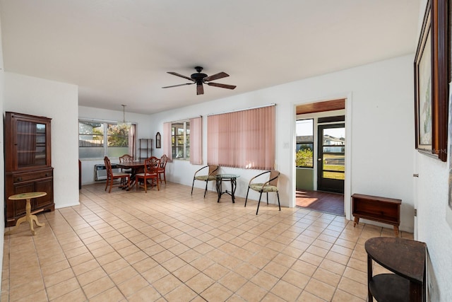 tiled living room with ceiling fan