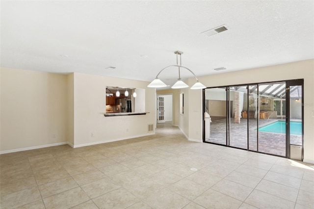 view of tiled spare room