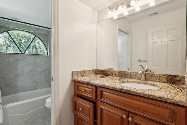 bathroom with vanity, tile patterned floors, and toilet