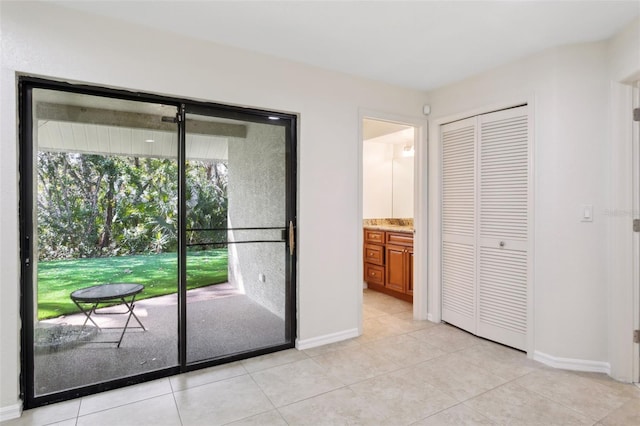 doorway featuring light tile patterned floors