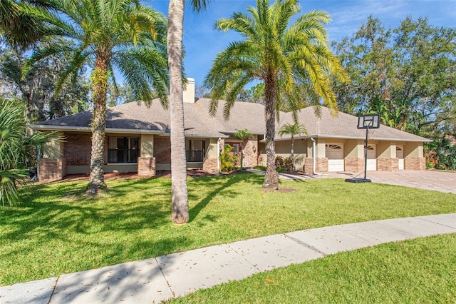 ranch-style house with a garage and a front yard