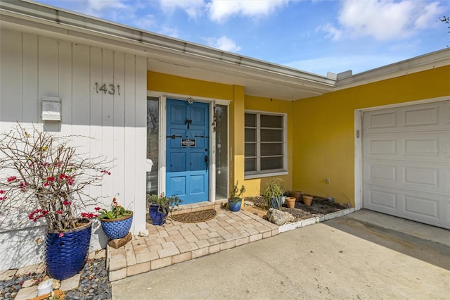 doorway to property featuring a garage