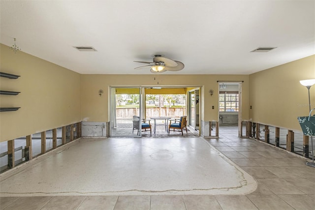 interior space with ceiling fan