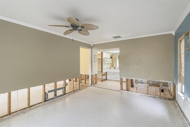 spare room with crown molding and ceiling fan