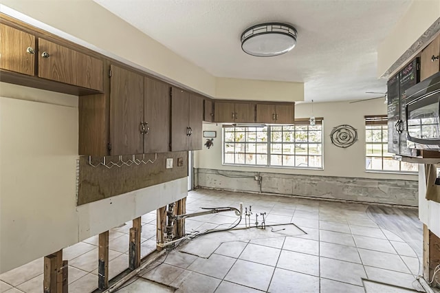 kitchen featuring light tile patterned flooring