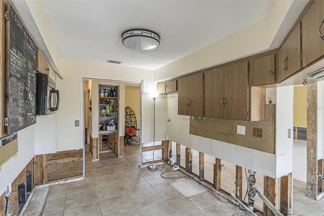 kitchen with light tile patterned floors