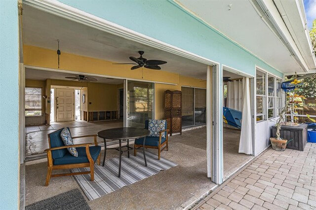 view of patio featuring ceiling fan