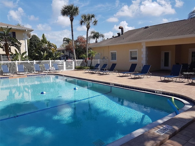 view of swimming pool featuring a patio area