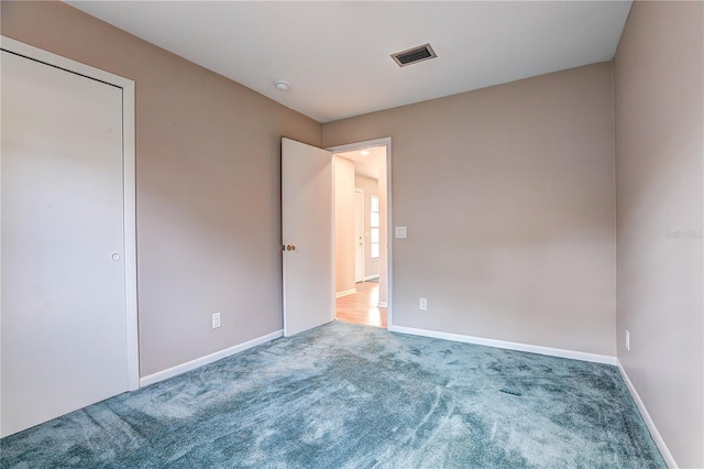 unfurnished bedroom featuring carpet flooring