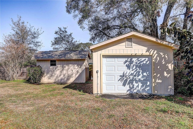 garage featuring a lawn