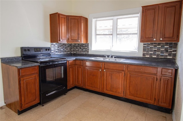 kitchen with black range with electric cooktop, backsplash, and sink