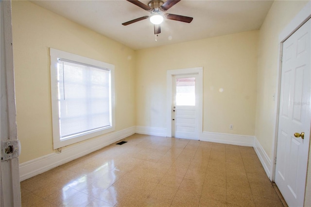 interior space featuring ceiling fan