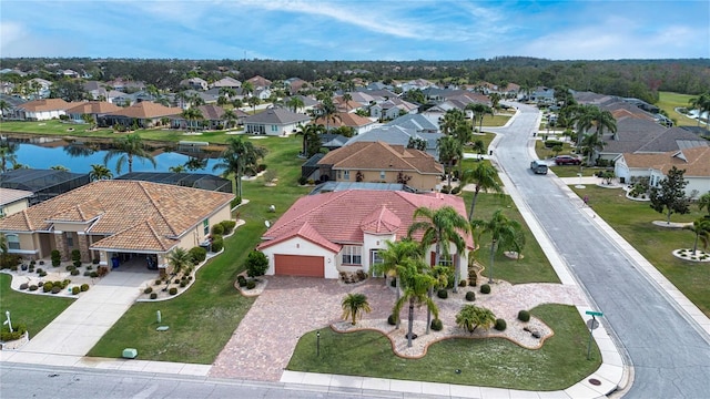 aerial view with a residential view and a water view