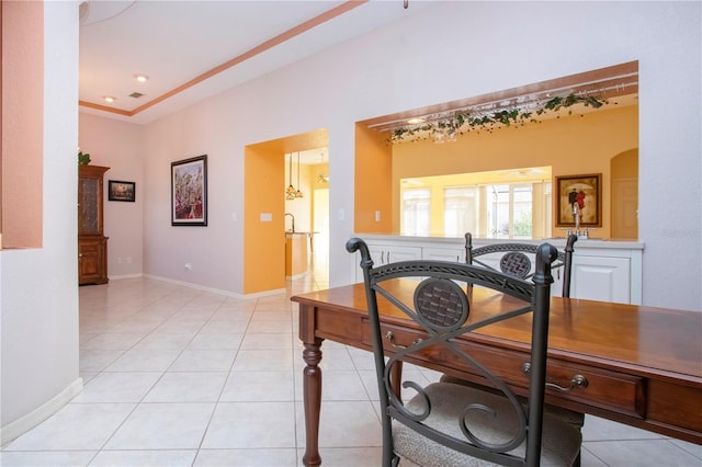 dining area with baseboards and light tile patterned flooring