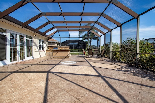 view of patio / terrace featuring glass enclosure