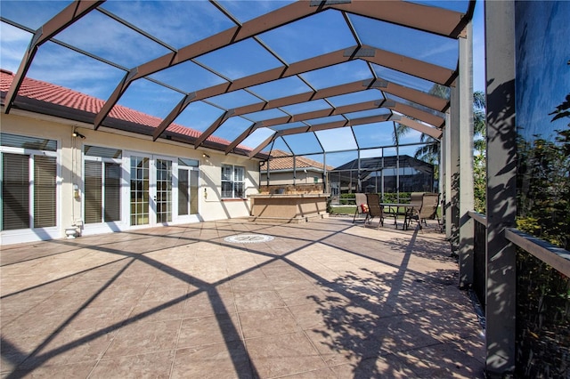 view of patio / terrace with glass enclosure