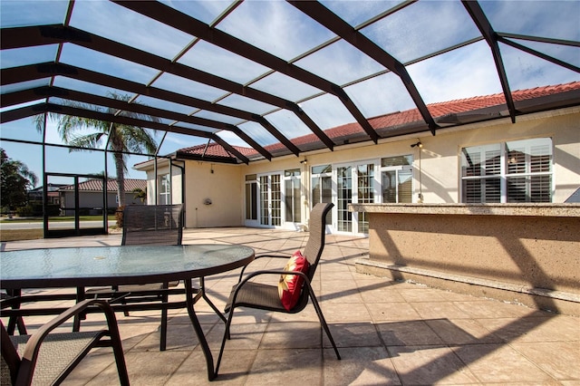 view of patio / terrace with glass enclosure and french doors