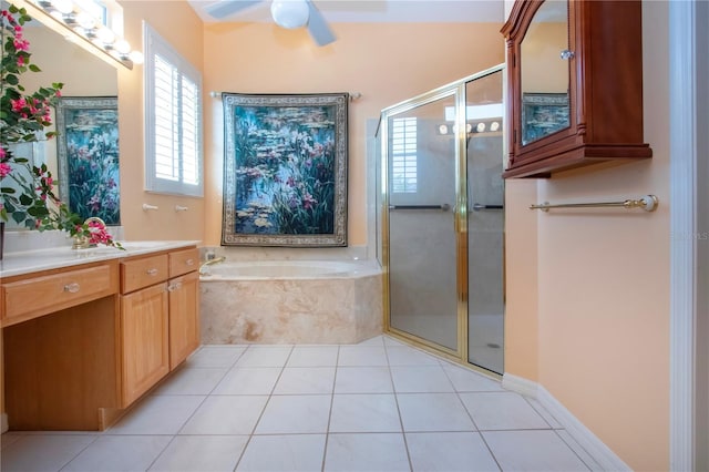 bathroom with a garden tub, a stall shower, ceiling fan, vanity, and tile patterned floors