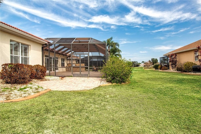 view of yard featuring a lanai, a patio area, and central air condition unit