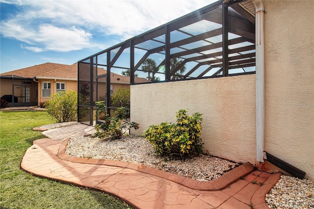 view of patio / terrace with a lanai