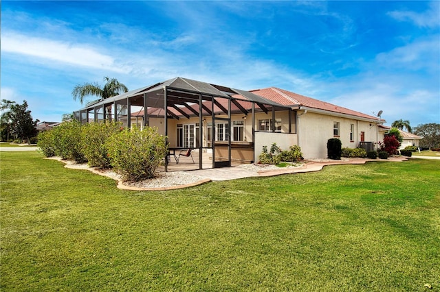 view of property exterior with a lanai, a patio area, a yard, and stucco siding