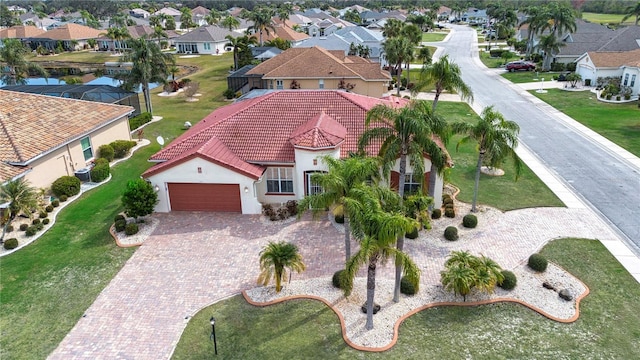 birds eye view of property with a residential view