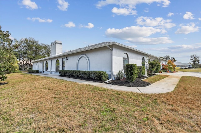23227 Club Villas Dr Unit 38, Land O Lakes, FL 34639 - view of side of home with a lawn