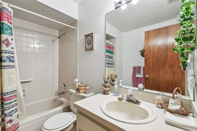 full bathroom featuring shower / tub combo with curtain, vanity, and toilet