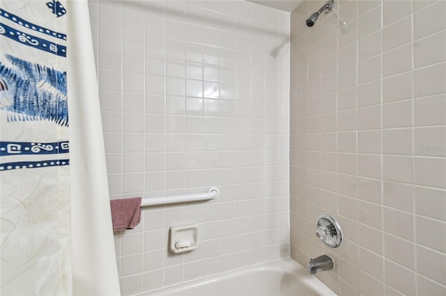 bathroom featuring shower / bath combo with shower curtain