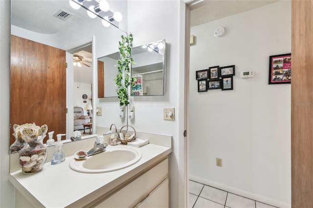 bathroom featuring ceiling fan, vanity, and tile patterned flooring