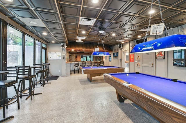 playroom with pool table and indoor bar