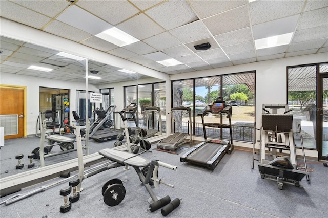 workout area with a drop ceiling