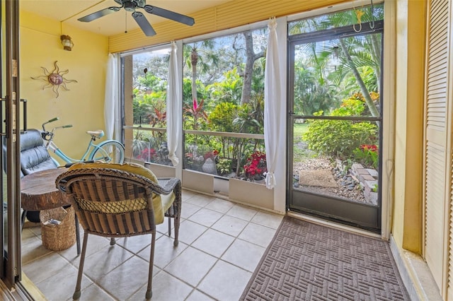 sunroom / solarium featuring ceiling fan