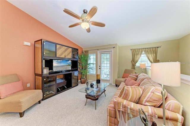 carpeted living room featuring vaulted ceiling and ceiling fan