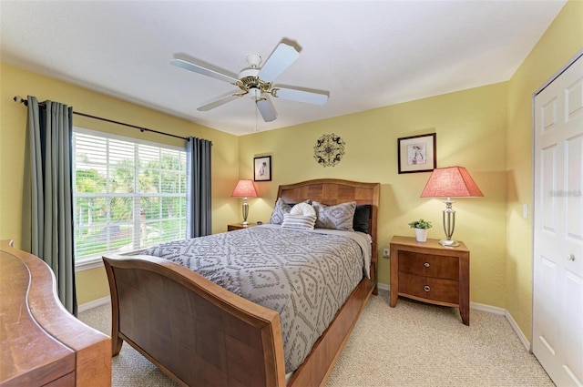 carpeted bedroom featuring ceiling fan