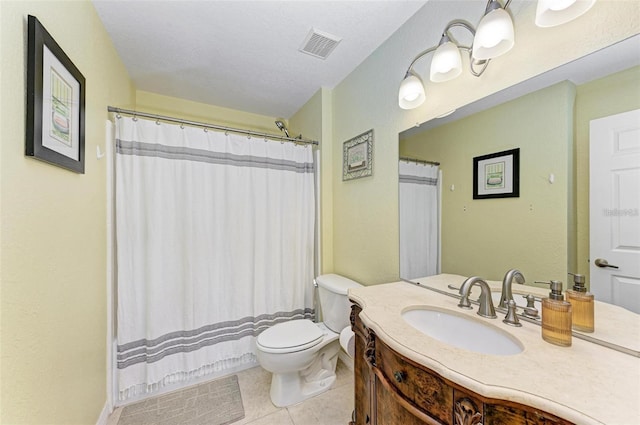 bathroom featuring vanity, toilet, tile patterned floors, a textured ceiling, and a shower with curtain