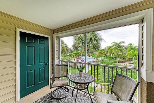 doorway to property featuring a balcony