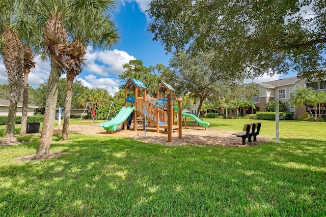 view of jungle gym featuring a lawn