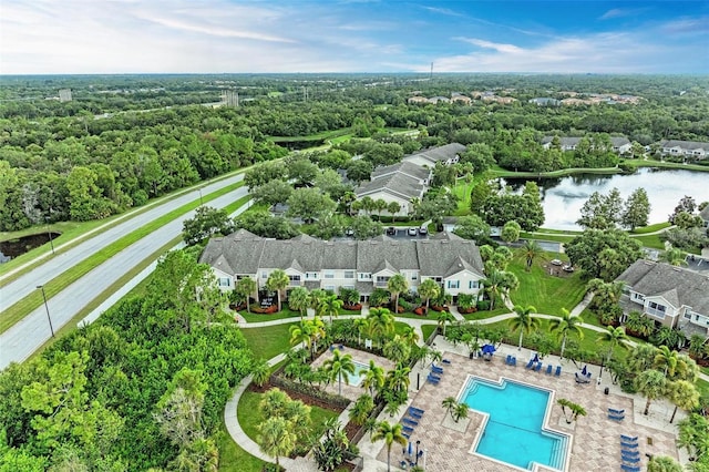 birds eye view of property with a water view