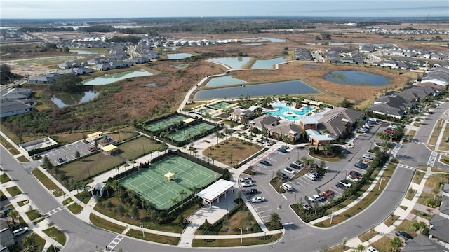 birds eye view of property with a water view