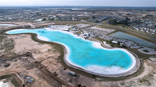 bird's eye view with a view of the beach and a water view