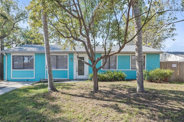 ranch-style house with a front lawn