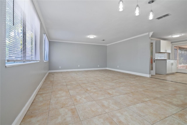 tiled empty room with crown molding