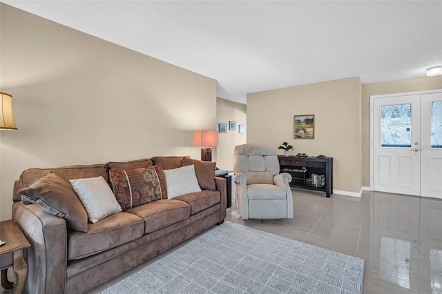 living room featuring french doors and light tile patterned flooring