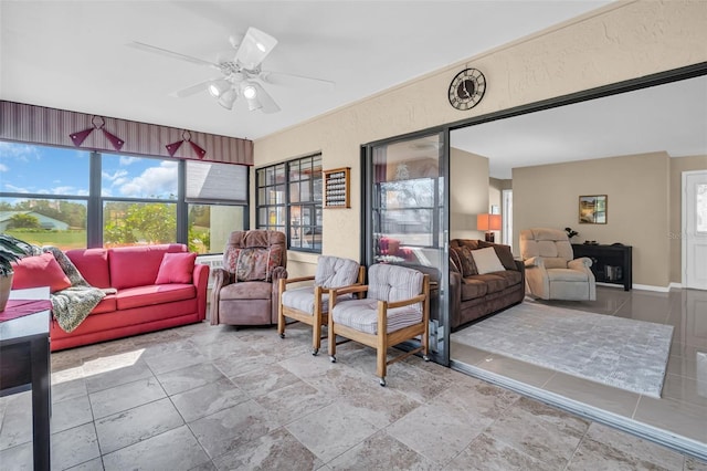 sunroom / solarium with ceiling fan