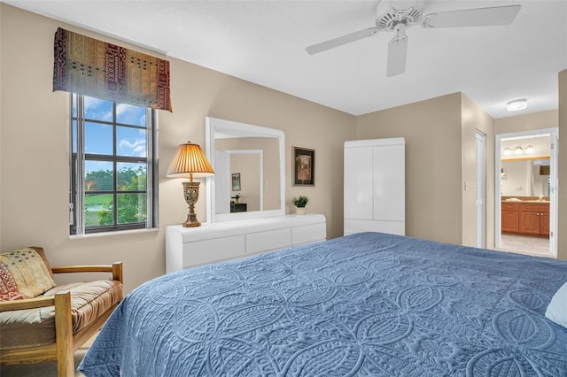 bedroom featuring connected bathroom and ceiling fan