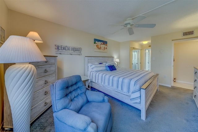 bedroom with light colored carpet, ceiling fan, and a closet