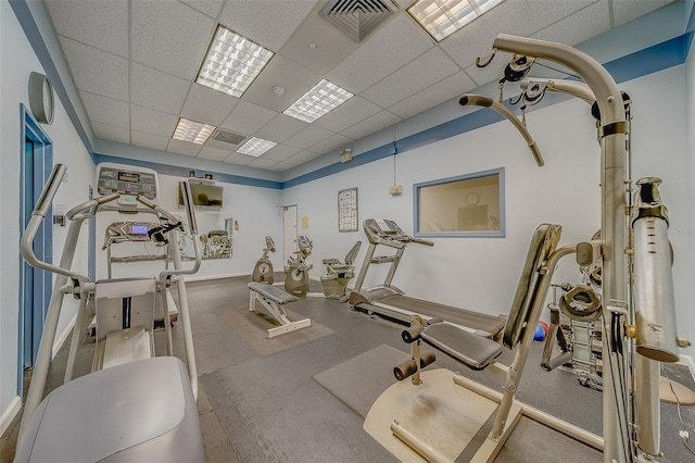 gym featuring a paneled ceiling