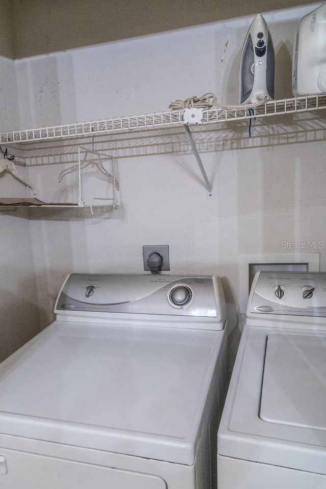 laundry area with separate washer and dryer